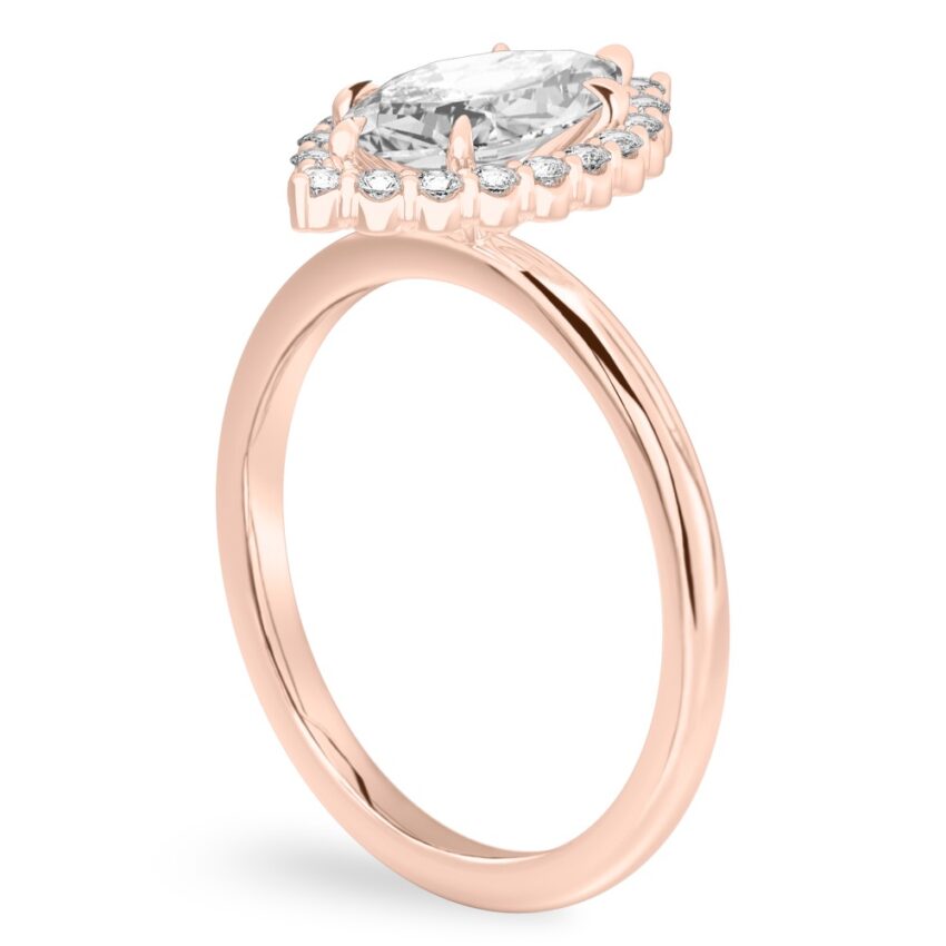 Angle view of marquise cut diamond floral halo engagement ring in rose gold