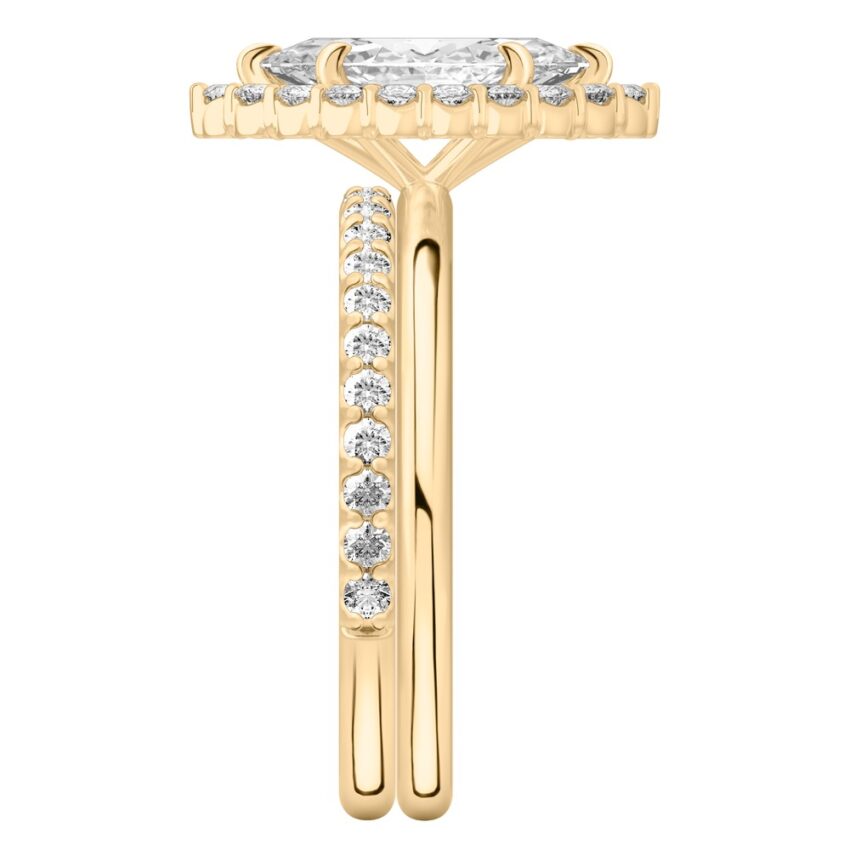 Side view of marquise cut diamond floral halo engagement ring set yellow gold