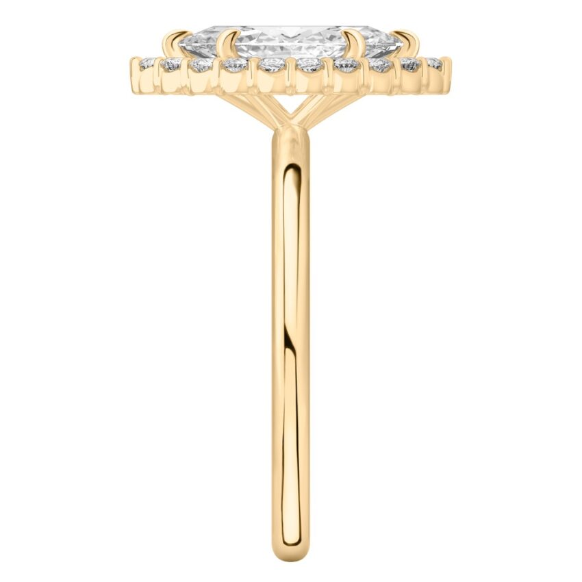 Side view of marquise cut diamond floral halo engagement ring in yellow gold