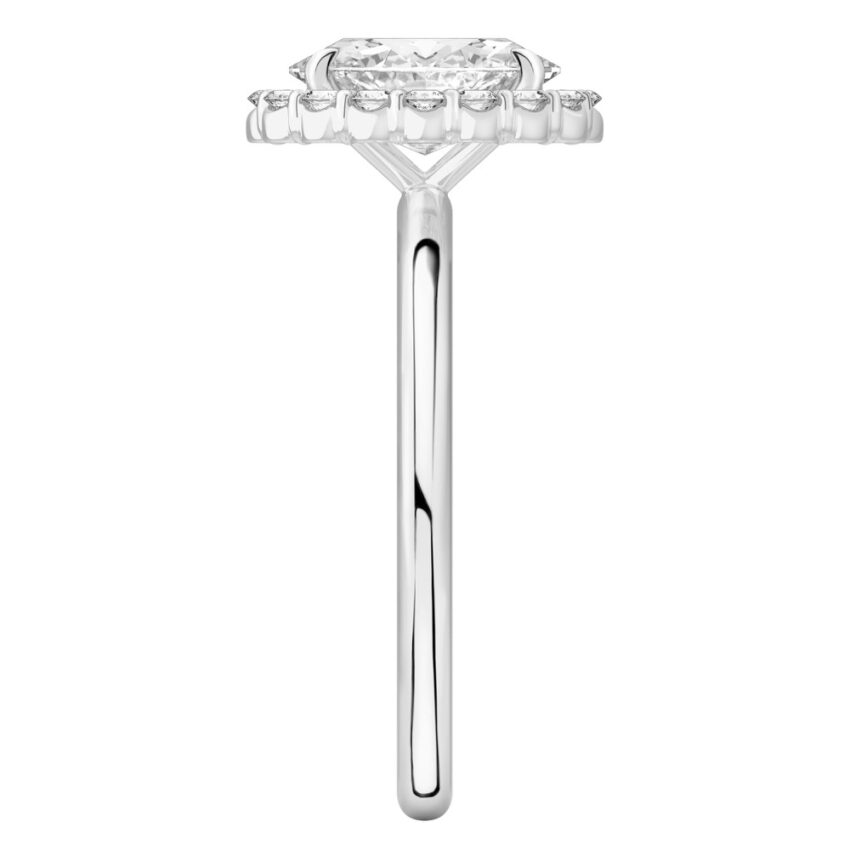 Side view of oval cut diamond floral halo engagement ring in platinum