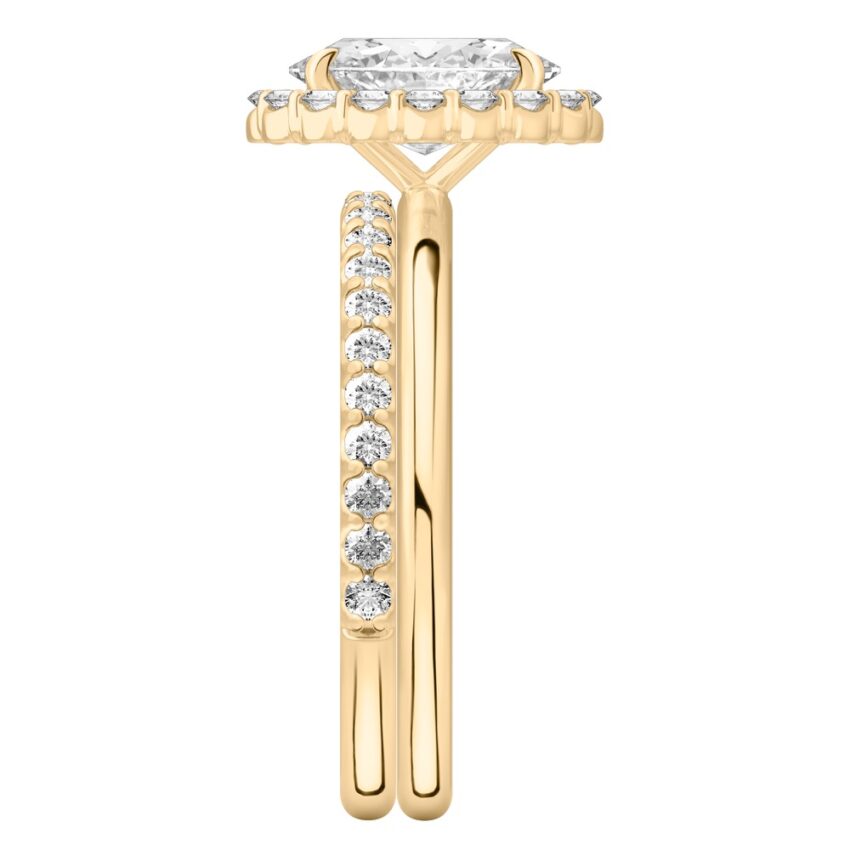 Side view of oval cut diamond floral halo engagement ring set yellow gold