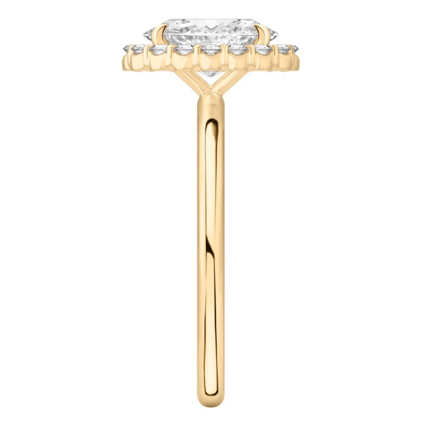Side view of oval cut diamond floral halo engagement ring in yellow gold