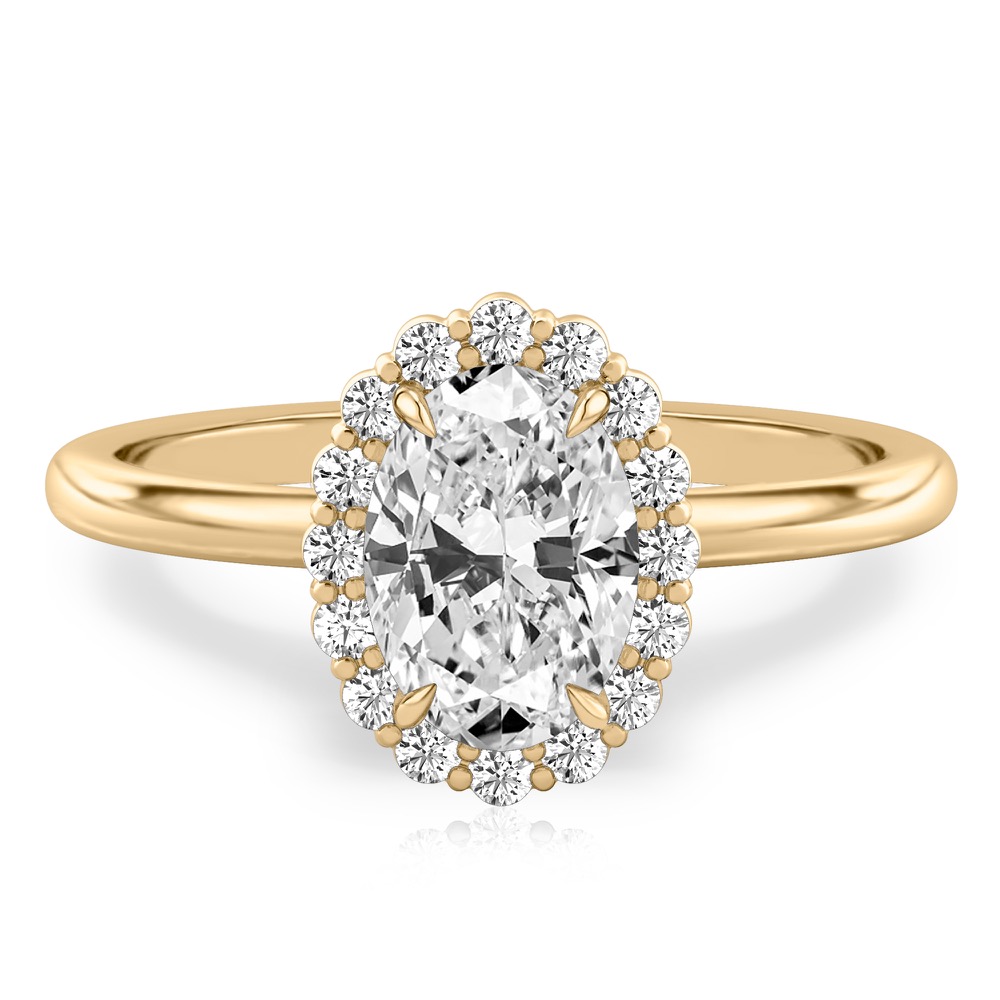 oval cut diamond floral halo engagement ring in yellow gold