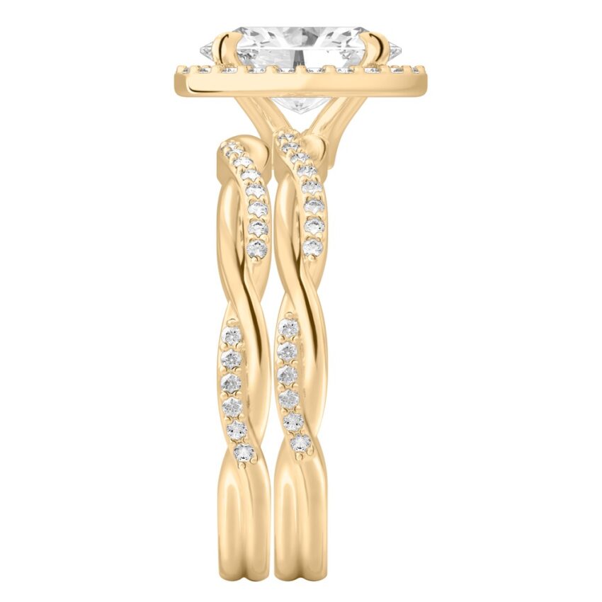 Side view of oval cut diamond twist halo engagement ring set yellow gold