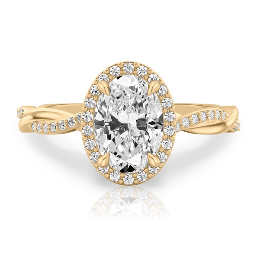 oval cut diamond twist halo engagement ring in yellow gold
