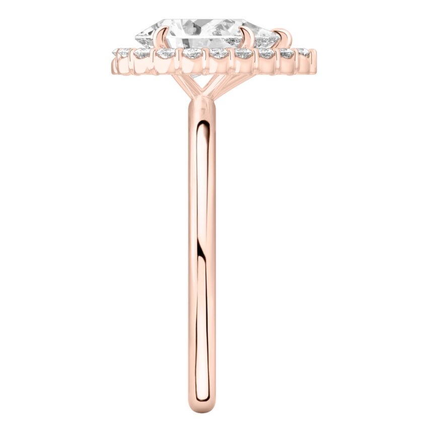 Side view of pear shape diamond floral halo engagement ring in rose gold