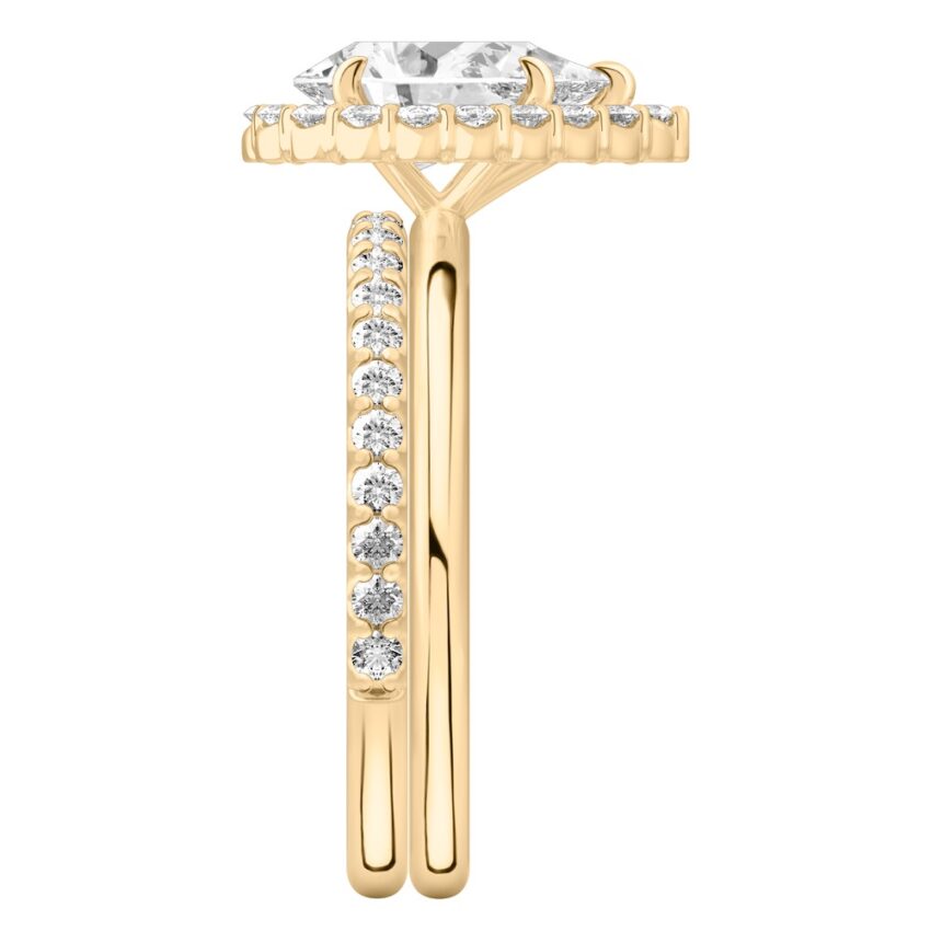 Side view of pear shape diamond floral halo engagement ring set yellow gold