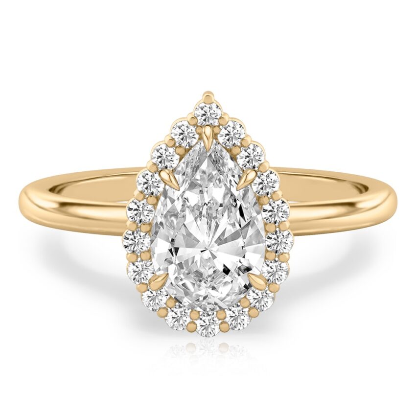 pear shape diamond floral halo engagement ring in yellow gold