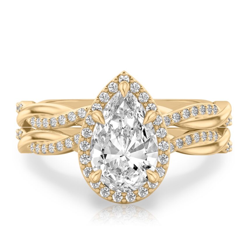 pear shape diamond twist halo engagement ring set yellow gold