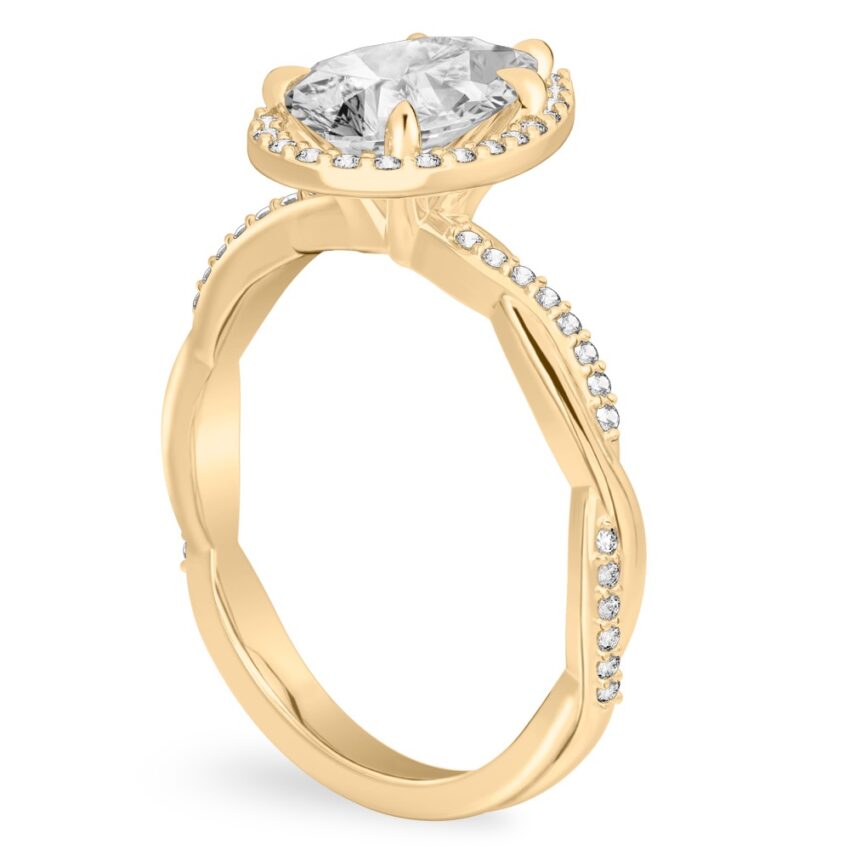 Angle view of pear shape diamond twist halo engagement ring in yellow gold