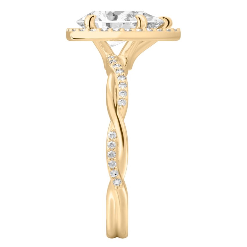 Side view of pear shape diamond twist halo engagement ring in yellow gold