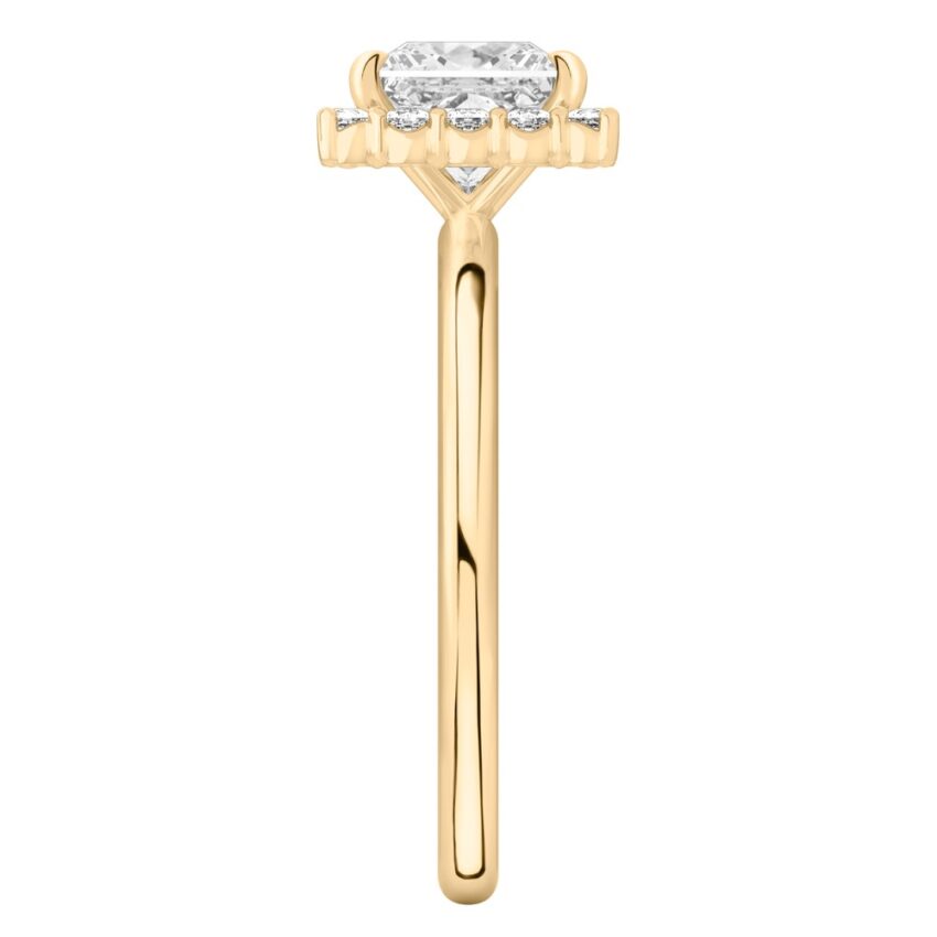 Side view of princess cut diamond floral halo engagement ring in yellow gold