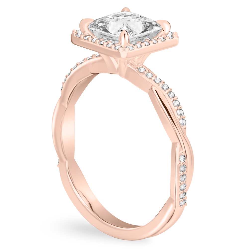 Angle view of princess cut diamond twist halo engagement ring in rose gold