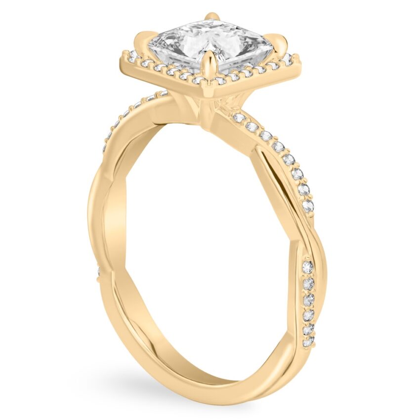 Angle view of princess cut diamond twist halo engagement ring in yellow gold