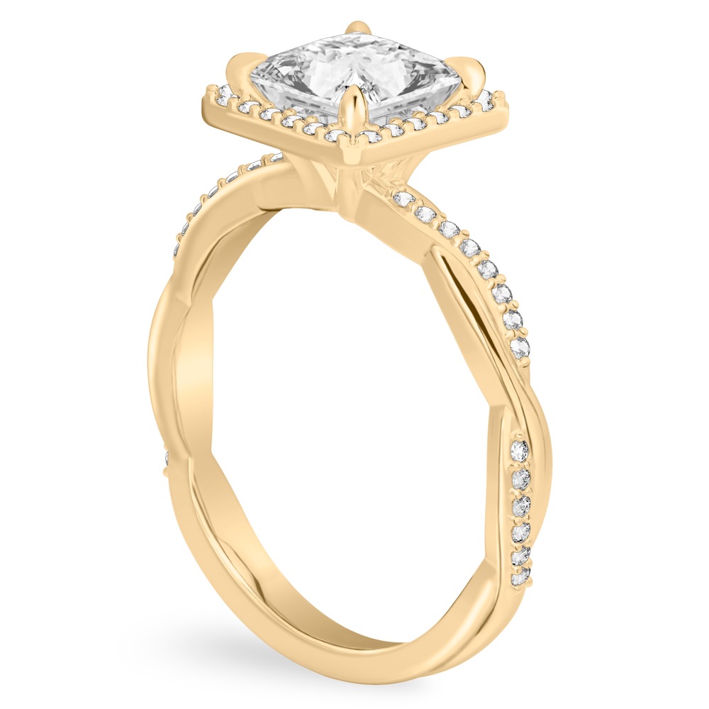 Angle view of princess cut diamond twist halo engagement ring in yellow gold