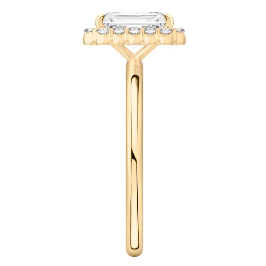 Side view of radiant cut diamond floral halo engagement ring in yellow gold