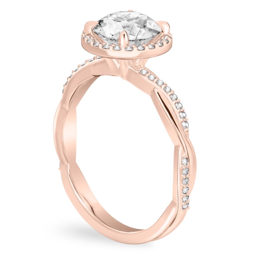 Angle view of round cut diamond twist halo engagement ring in rose gold