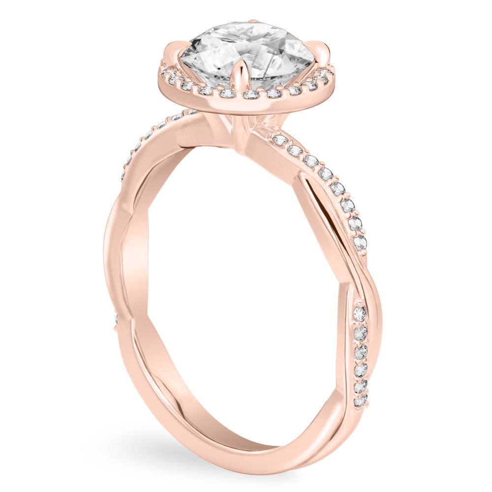 Angle view of round cut diamond twist halo engagement ring in rose gold