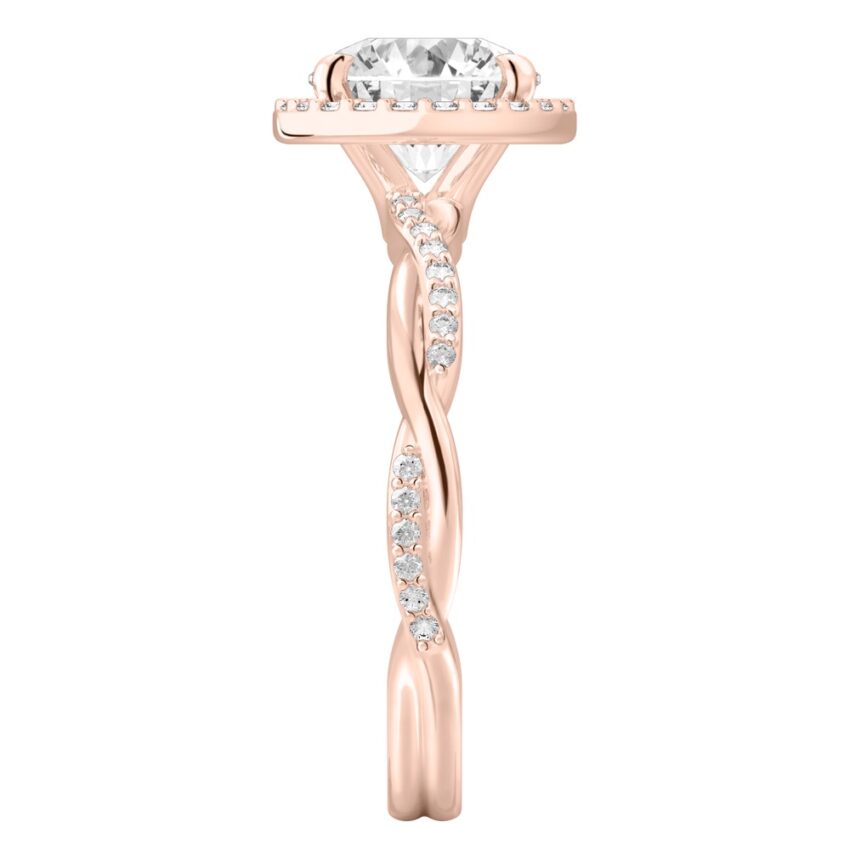 Side view of round cut diamond twist halo engagement ring in rose gold