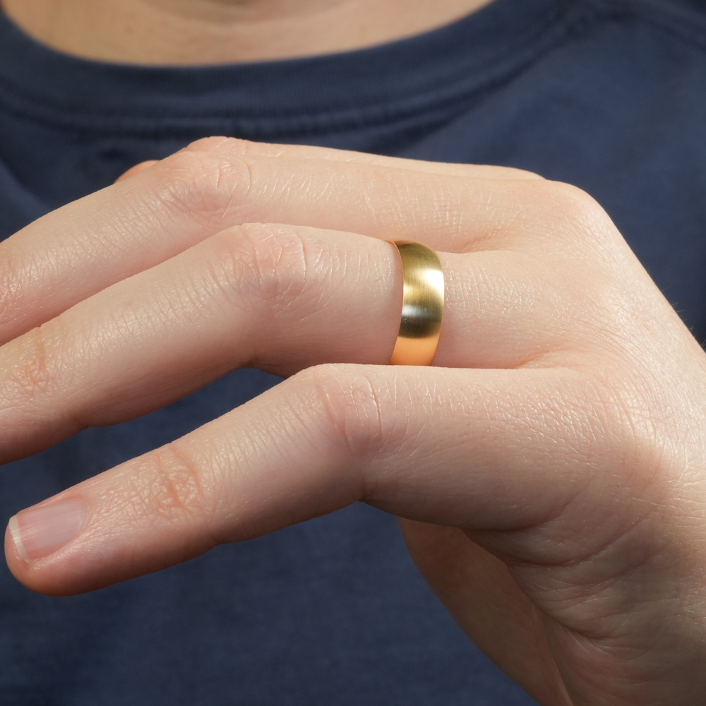 Angle view of matte wedding band in lifestyle