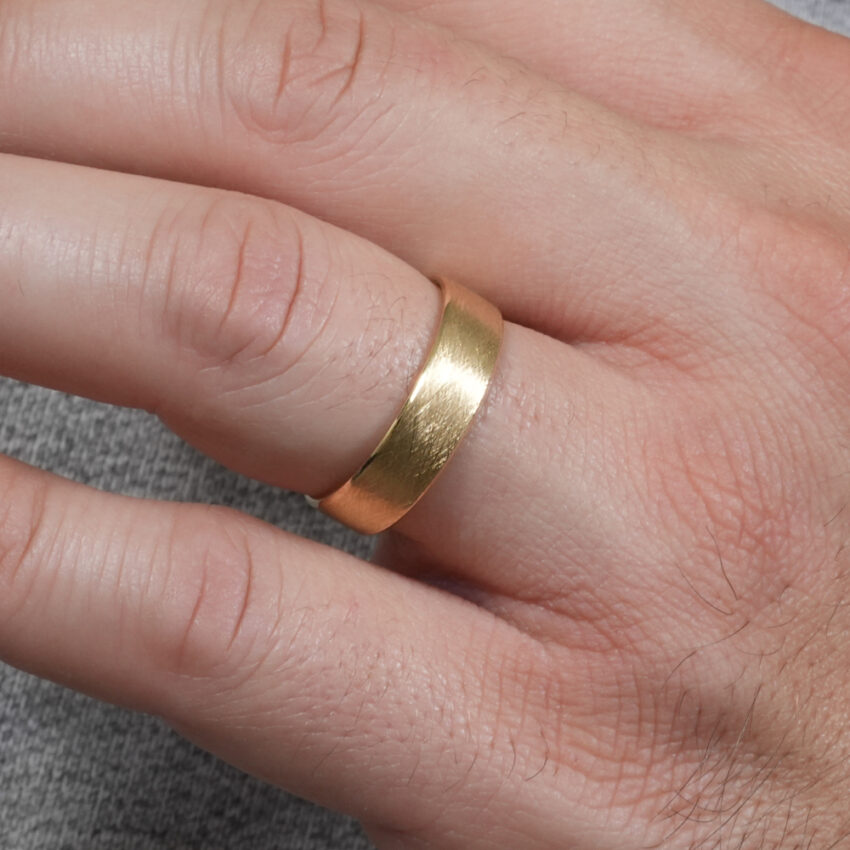 Angle view of men's vintage wedding ring in lifestyle