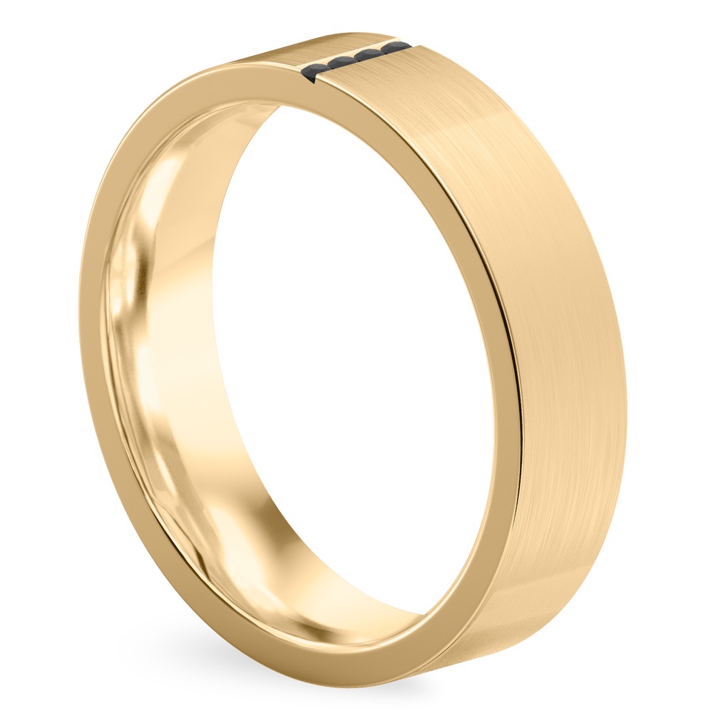 Angle view of black diamond wedding band in yellow gold