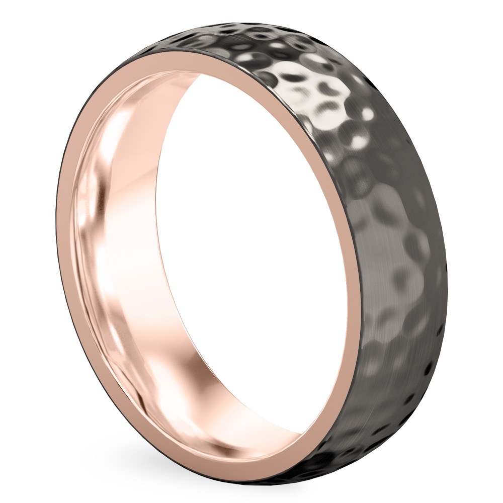 Angle view of black wedding ring in rose gold