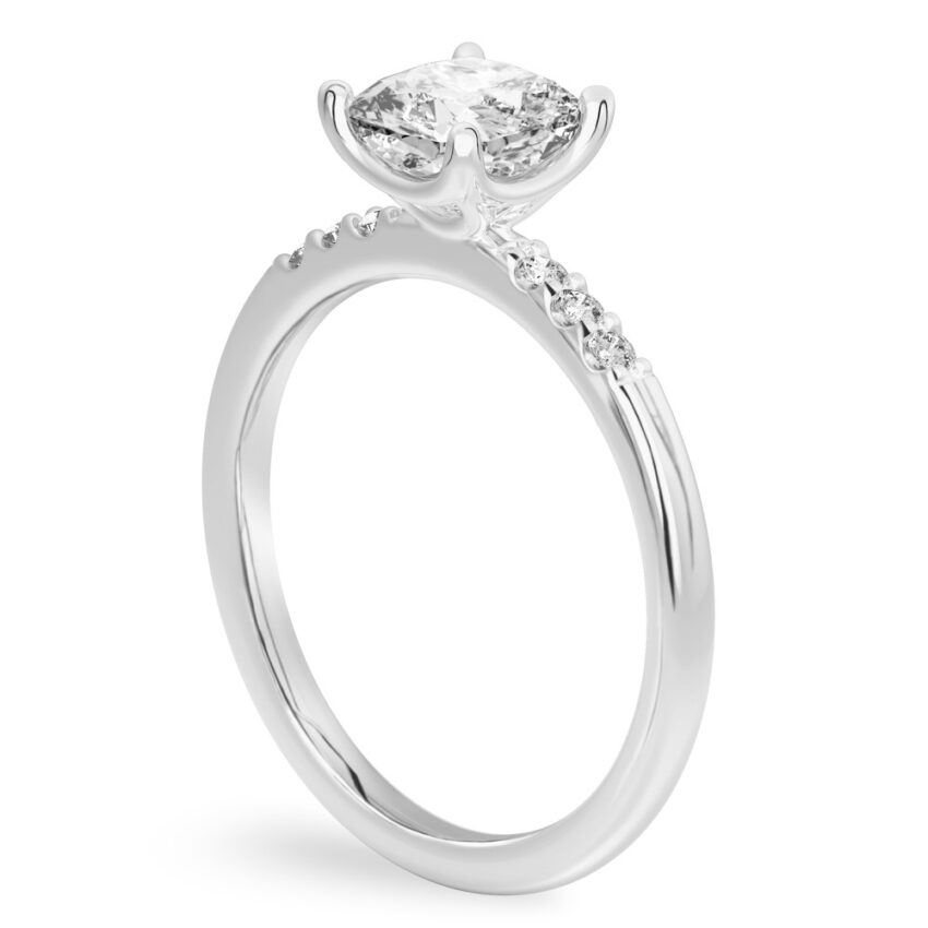 Angle view of cushion cut diamond minimalist pave engagement ring in palladium