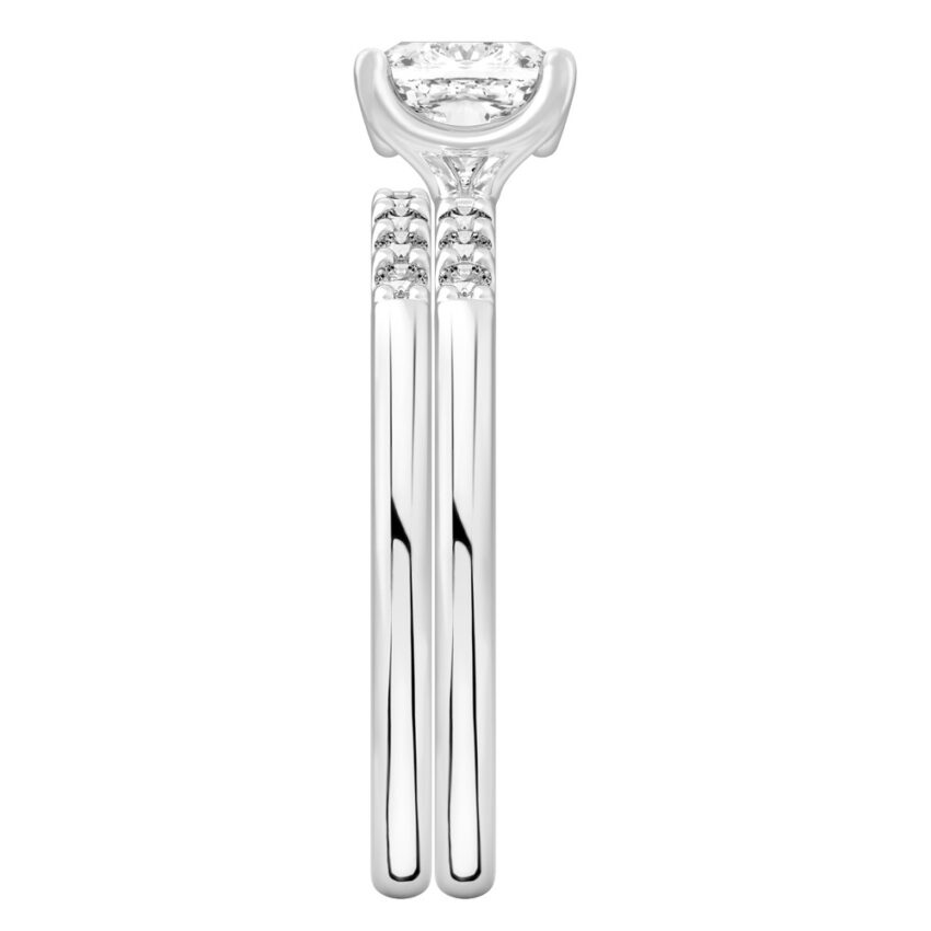 Side view of cushion cut diamond minimalist pave engagement ring set palladium