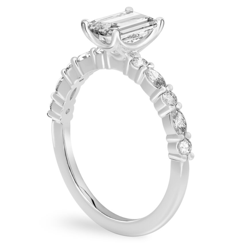 Angle view of emerald cut diamond marquise and round diamond ring palladium