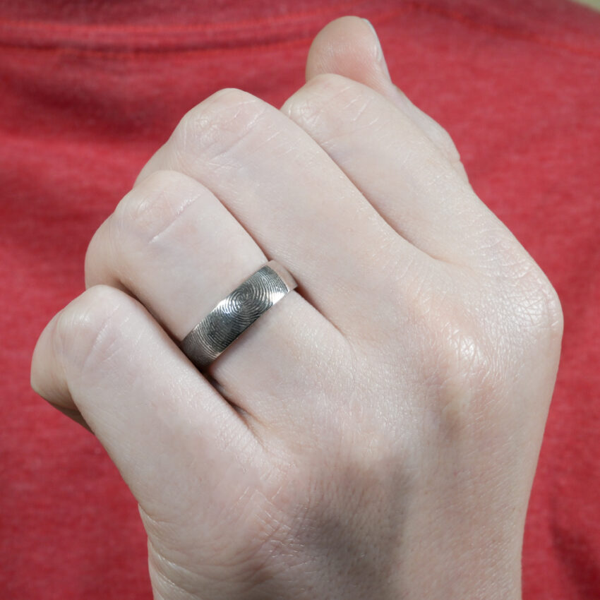 Video of fingerprint wedding band in lifestyle
