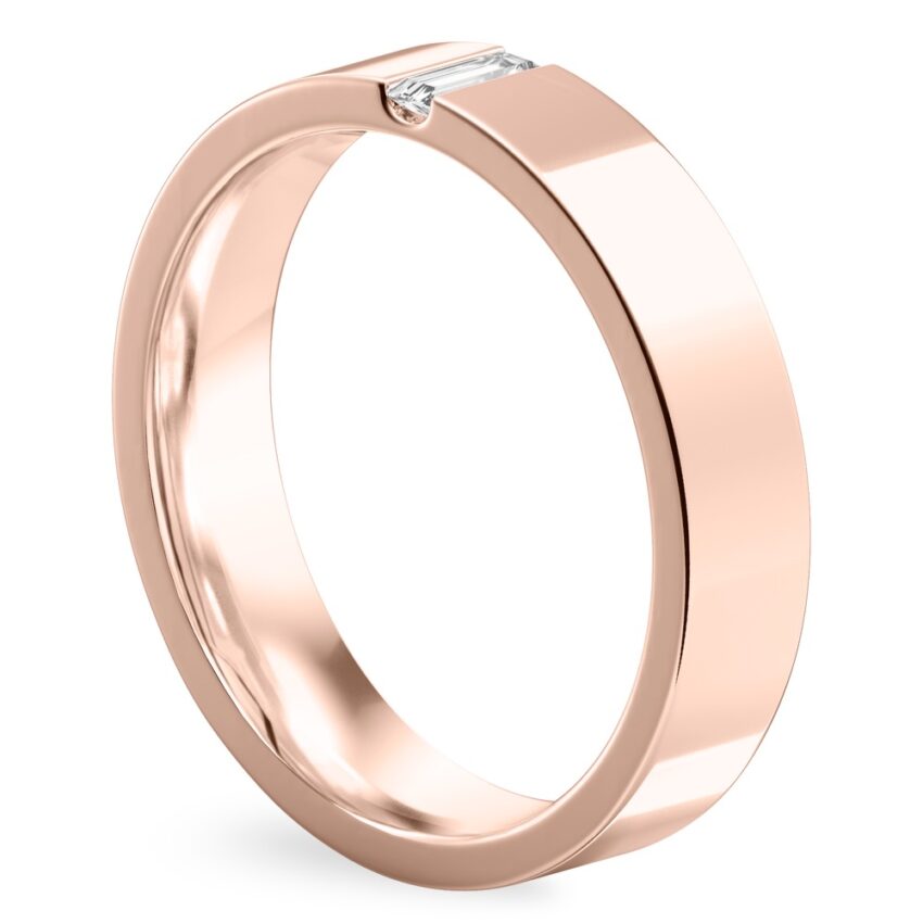 Angle view of flush baguette wedding band in rose gold