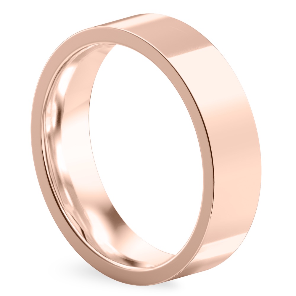 Angle view of high polish flat wedding band in rose gold