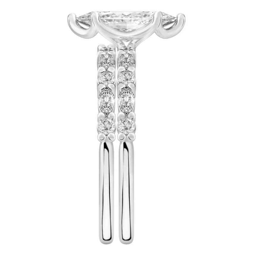 Side view of marquise cut diamond marquise and round diamond ring set palladium