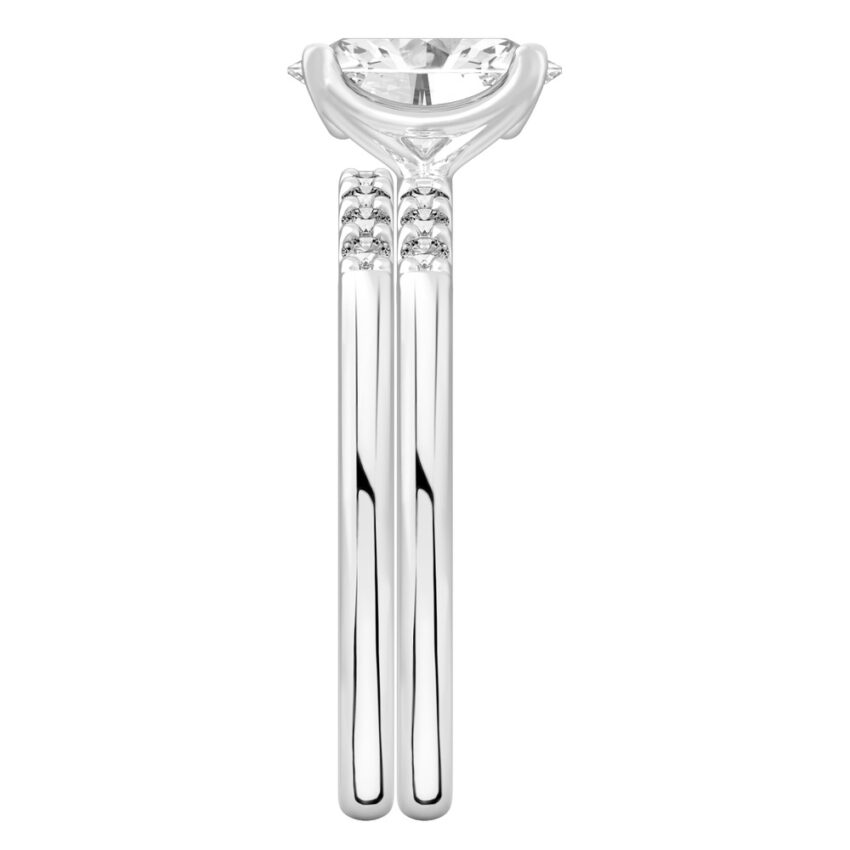 Side view of oval cut diamond minimalist pave engagement ring set palladium