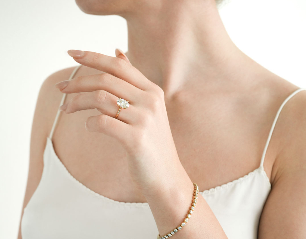 yellow gold oval engagement ring in and tennis bracelet