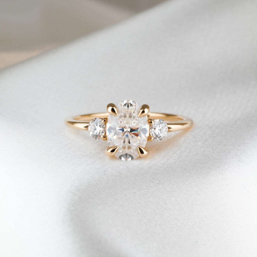1.80 carat three stone engagement ring_yellow gold_lifestyle_front 1.80 carat three stone engagement ring in_yellow gold_lifestyle_front