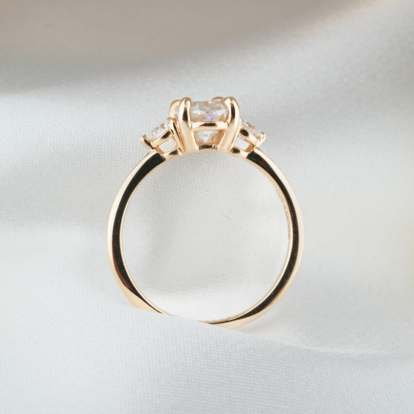 1.80 carat three stone engagement ring_yellow gold_lifestyle_standing 1.80 carat three stone engagement ring in_yellow gold_lifestyle_standing