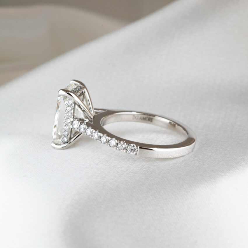 Side view of 3.02 carat custom pave cathedral engagement ring in_platinum_lifestyle_side