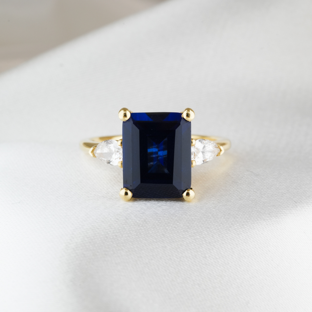 Side view of 3.50 carat pear stone engagement ring in_yellow gold_lifestyle_front