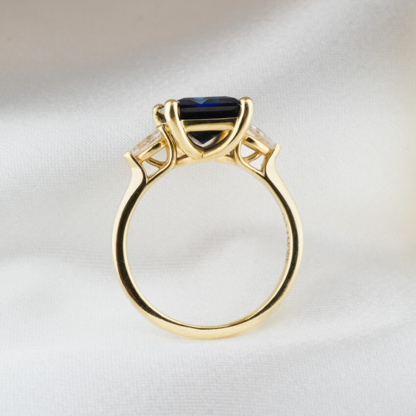 Side view of 3.50 carat pear stone engagement ring in_yellow gold_lifestyle_standing